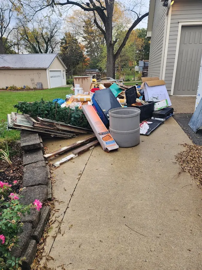 Dumpster being loaded with debris for Roofing Dumpster Rental in Frackville